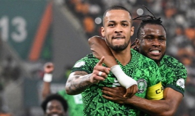 Nigeria’s William Troost-Ekong celebrates with Super Eagles teammates during a World Cup qualifying match.